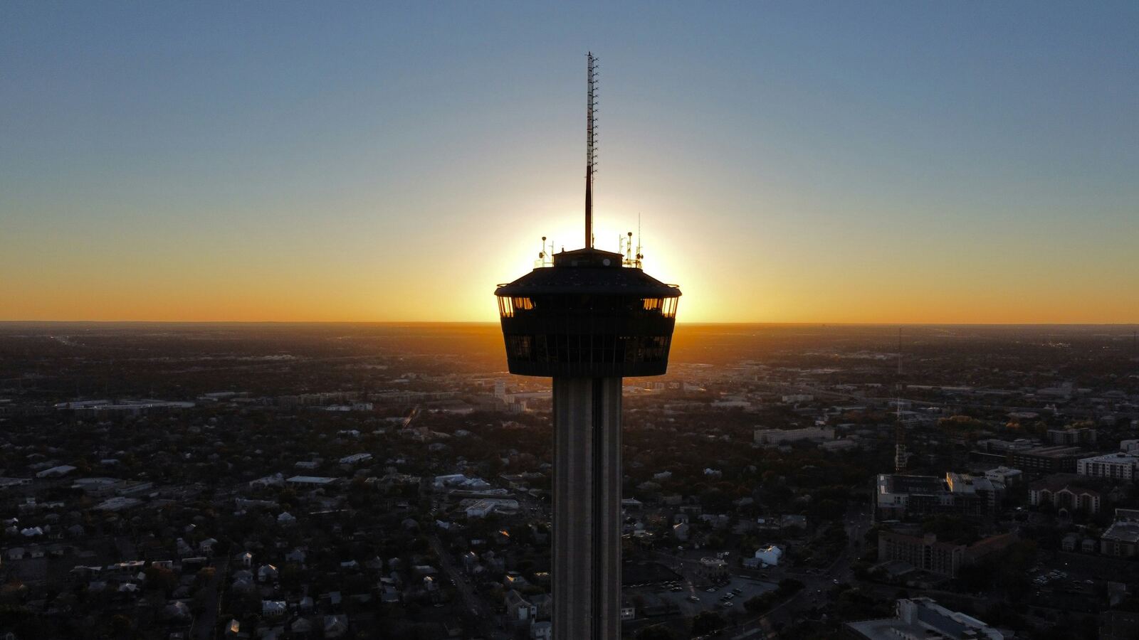 Aerial view of the Tower of the Americas above San Antonio at sunset
